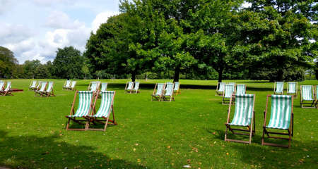 Lawn chairs at Hyde Park on a beautiful summer day.の写真素材