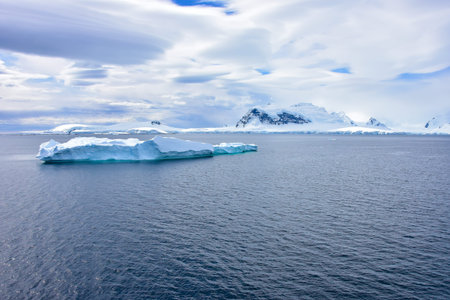 A beautiful blue iceberg floating off Antarctica.