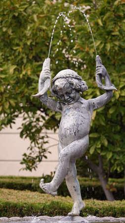 Kiev, Ukraine October 12, 2019: Sculpture of a fountain boy with fish on the estate of the exiled President of Ukraine Yanukovych in Mizhhiryaのeditorial素材