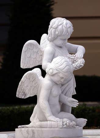 Kiev, Ukraine November 1, 2019: The sculpture "Angels are playing" they adorn the entrance to the Mariinsky Palace in Kievのeditorial素材