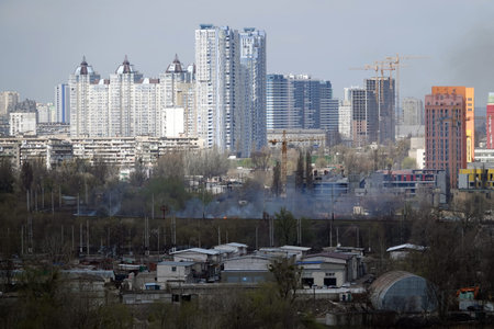 Kiev, Ukraine April 1, 2020: grass burns near the railway in the center of Kiev