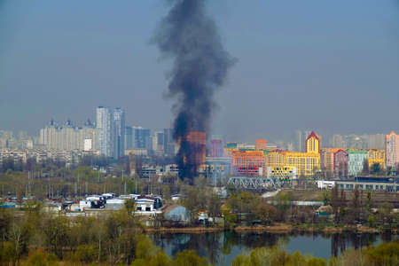 Kiev, Ukraine March 29, 2020: Fire in one of the buildings of the city of Kiev view from the topのeditorial素材