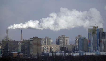 Kiev, Ukraine January 19, 2021: Chimneys smoke, polluting the air in the city worsening the environmentのeditorial素材