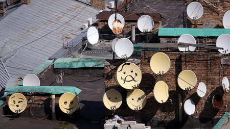 Artists painted antennas on the roofs in the form of emoticonsのeditorial素材