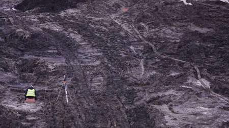 Kiev, Ukraine, October 17, 2018: Workers in the mud of a construction site at the stage of excavation; construction of a supermarket AUCHANのeditorial素材