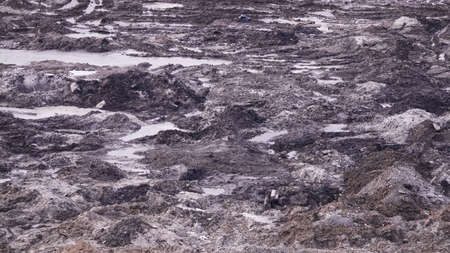 Kiev, Ukraine, October 17, 2018: Workers in the mud of a construction site at the stage of excavation; construction of a supermarket AUCHANのeditorial素材