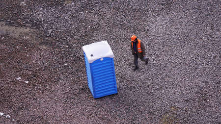 Kiev, Ukraine, October 17, 2018: Workers in the mud of a construction site at the stage of excavation; construction of a supermarket AUCHANのeditorial素材