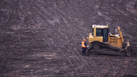Kiev, Ukraine, October 17, 2018: Workers in the mud of a construction site at the stage of excavation; construction of a supermarket AUCHANのeditorial素材