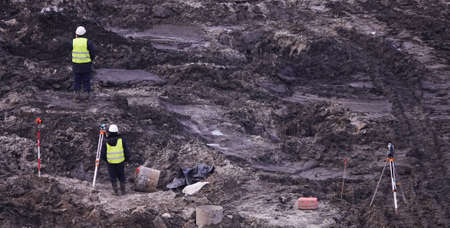 Kiev, Ukraine, October 17, 2018: Workers in the mud of a construction site at the stage of excavation; construction of a supermarket AUCHANのeditorial素材