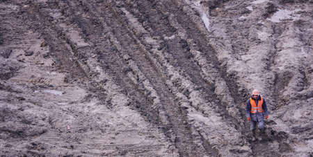 Kiev, Ukraine, October 17, 2018: Workers in the mud of a construction site at the stage of excavation; construction of a supermarket AUCHANのeditorial素材
