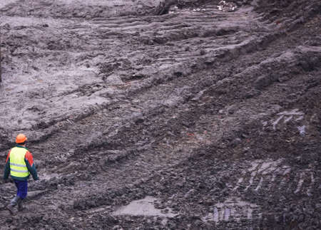 Kiev, Ukraine, October 17, 2018: Workers in the mud of a construction site at the stage of excavation; construction of a supermarket AUCHANのeditorial素材