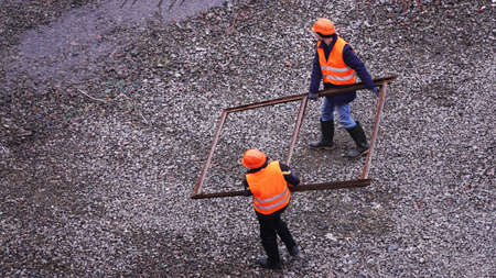 Kiev, Ukraine, October 17, 2018: Workers in the mud of a construction site at the stage of excavation; construction of a supermarket AUCHANのeditorial素材