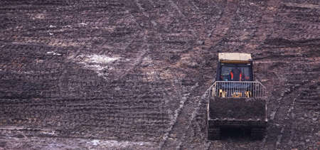 Kiev, Ukraine, October 17, 2018: Workers in the mud of a construction site at the stage of excavation; construction of a supermarket AUCHANのeditorial素材
