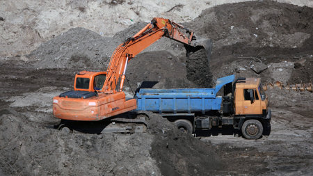 Kiev, Ukraine March 13, 2019: Tractors and excavators work on the construction of the foundation...
