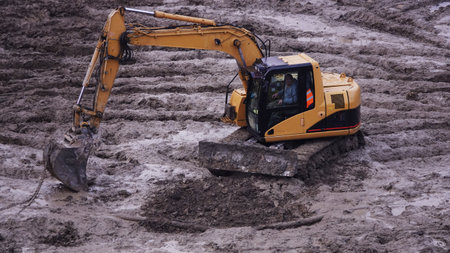 Kiev, Ukraine, October 17, 2018: Workers in the mud of a construction site at the stage of...