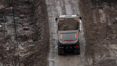 Kiev, Ukraine March 13, 2019: Tractors and excavators work on the construction of the foundation zero cycleのeditorial素材