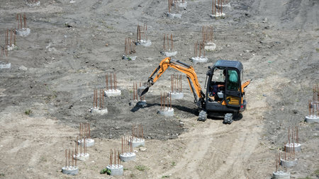 Kiev, Ukraine March 13, 2019: Tractors and excavators work on the construction of the foundation zero cycleのeditorial素材