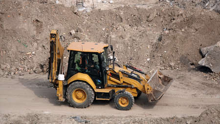 Kiev, Ukraine March 13, 2019: Tractors and excavators work on the construction of the foundation zero cycleのeditorial素材