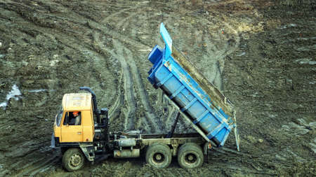 Kiev, Ukraine March 13, 2019: Tractors and excavators work on the construction of the foundation zero cycleのeditorial素材