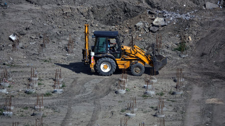 Kiev, Ukraine March 13, 2019: Tractors and excavators work on the construction of the foundation...
