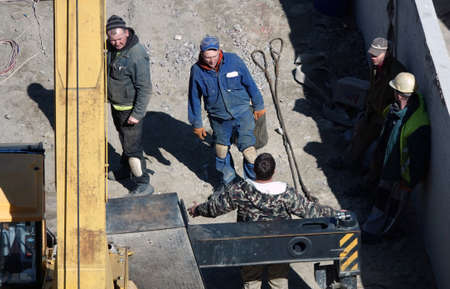 Kiev, Ukraine March 13, 2019: Workers - zero-cycle construction of the foundation of an entertainment centerのeditorial素材