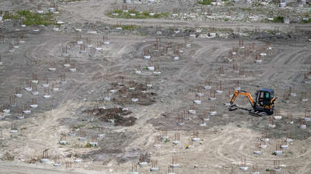 Kiev, Ukraine March 13, 2019: Tractors and excavators work on the construction of the foundation zero cycleのeditorial素材