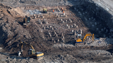 Kiev, Ukraine March 13, 2019: Tractors and excavators work on the construction of the foundation zero cycleのeditorial素材