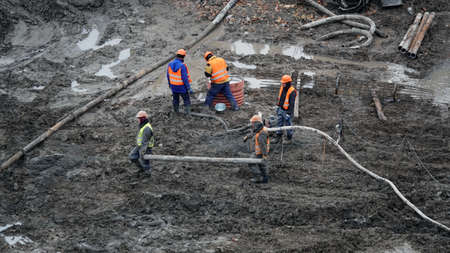 Kiev, Ukraine March 13, 2019: Workers - zero-cycle construction of the foundation of an entertainment centerのeditorial素材