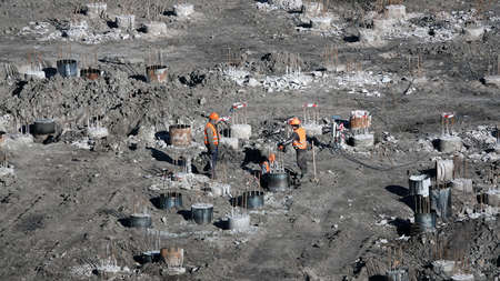 Kiev, Ukraine March 13, 2019: Workers - zero-cycle construction of the foundation of an entertainment centerのeditorial素材