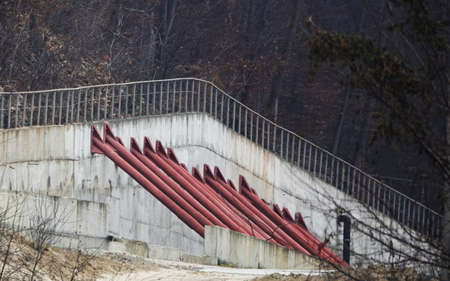 Kiev, Ukraine December 10, 2020: Concrete wall with props to protect the mountain from landslidesのeditorial素材