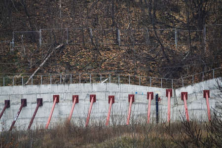 Kiev, Ukraine December 10, 2020: Concrete wall with props to protect the mountain from landslidesのeditorial素材