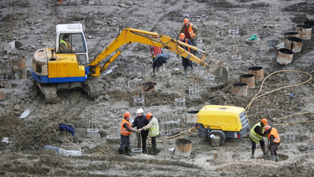 Kiev, Ukraine March 13, 2019: Workers and machinery - zero-cycle construction of the foundation of...