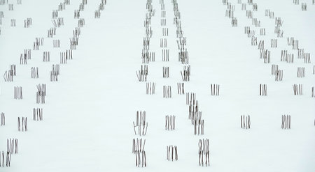 Frozen construction foundation fittings sticking out from under the snowのeditorial素材