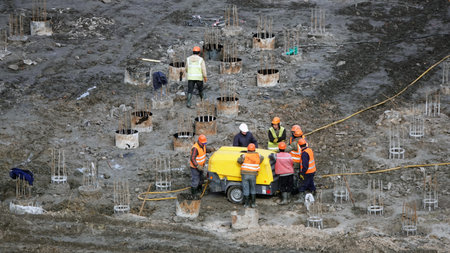 Kiev, Ukraine March 13, 2019: Workers and machinery - zero-cycle construction of the foundation of...