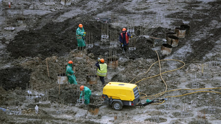 Kiev, Ukraine March 13, 2019: Workers and machinery - zero-cycle construction of the foundation of...