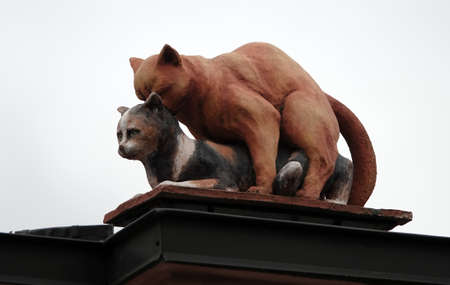 Kiev, Ukraine October 24, 2020: Sculpture of a cat having sex with a cat on a fenceのeditorial素材