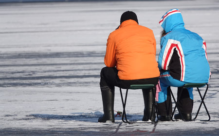 Kiev, Ukraine January 23, 2021: Ice fishing fishermen on ice in winterの写真素材