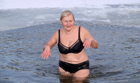 Kiev, Ukraine January 19, 2021: Swimming in the ice-hole in winter on the day of the Baptism of Rusのeditorial素材