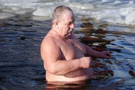 Kiev, Ukraine January 19, 2021: Swimming in the ice-hole in winter on the day of the Baptism of Rusのeditorial素材