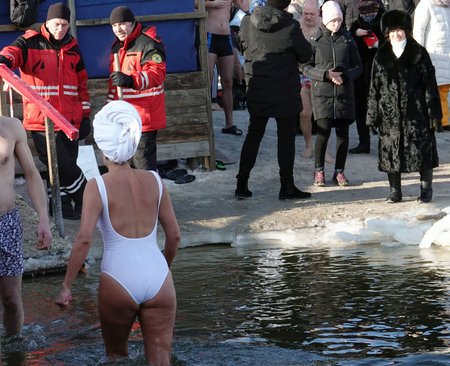 Kiev, Ukraine January 19, 2021: Swimming in the ice-hole in winter on the day of the Baptism of Rusのeditorial素材