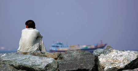 Sharjah, United Arab Emirates February 20, 2020: Workers in the UAE sit and think about their...