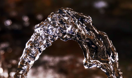 Water in the fountain flies, drips, foams, flows