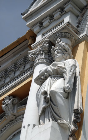Kiev, Ukraine June 10, 2020: Artistic decoration of the facade of the building with sculptures of people in the city of Kievのeditorial素材