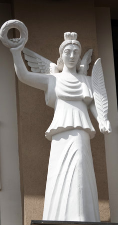 Kiev, Ukraine June 10, 2020: Artistic decoration of the facade of the building with sculptures of people in the city of Kievのeditorial素材