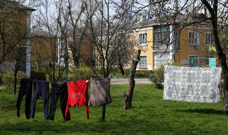 Kiev, Ukraine April 27, 2021: Washed clothes are dried on a rope in an old courtyardのeditorial素材