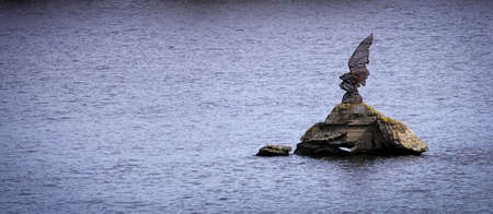 Kiev, Ukraine March 13, 2020: a monument to an eagle on the Dnieper River smashed by vandalsの写真素材