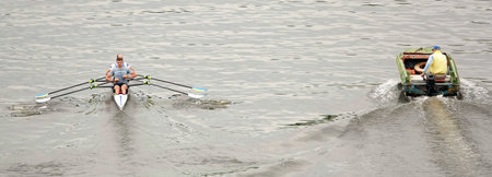 Kiev, Ukraine June 20, 2020: A fisherman catches fish from a boat on a river