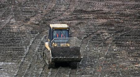 Kiev, Ukraine August 29, 2019: Tractors and excavators work on the construction of the foundation of...