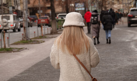 Kiev, Ukraine January 02, 2022: A young blonde girl walks along the street of Kievのeditorial素材