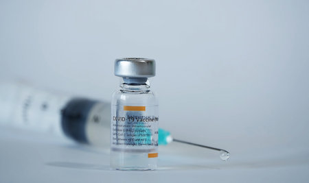 COVID-19 coronavirus vaccine and syringe filled for vaccinationのeditorial素材